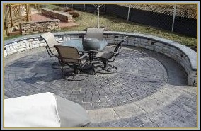 Stamped Concrete Circle with Separate Color Border, Stone Walls with Custom Lighting