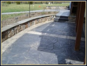 Stamped Concrete Flagstone Patio with Stone Seating Walls