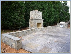 Stamped Old English Stone Patio with Fireplace and Grill